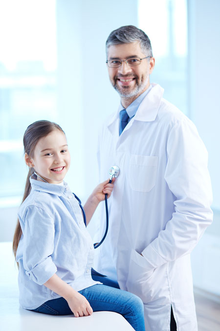 Image of girl using stethoscope on Doctor