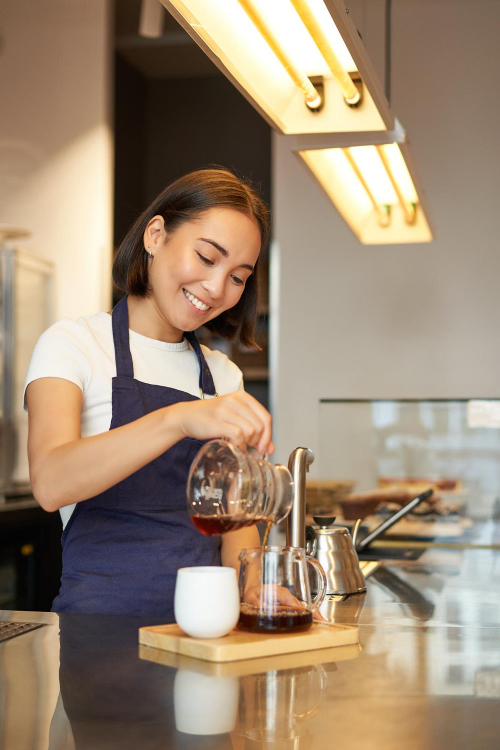 Korean Barista pouring coffee image