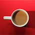 Cup of coffee on a red background