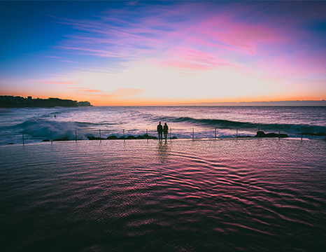 Silhouette of a person on a beach at sunrise