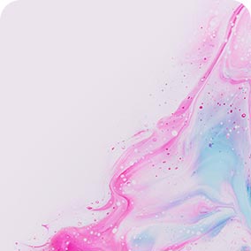 Abstract pink and blue fluid art blending on a light background with delicate splatters and smooth transitions.