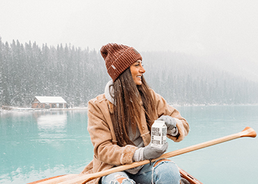 Image of woman in boat with paddle