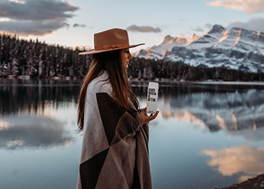Image of woman with mountain and lake background