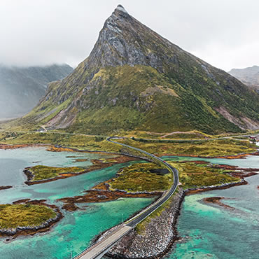 Image of mountain and road with water
