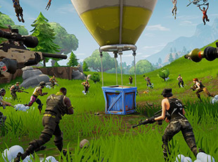 Characters armed with weapons approach a supply drop descending from a hot air balloon in a vibrant outdoor battle scene.