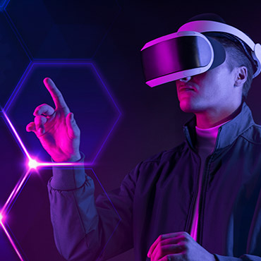 Person wearing virtual reality headset interacting with glowing hexagonal digital interface in dark room.